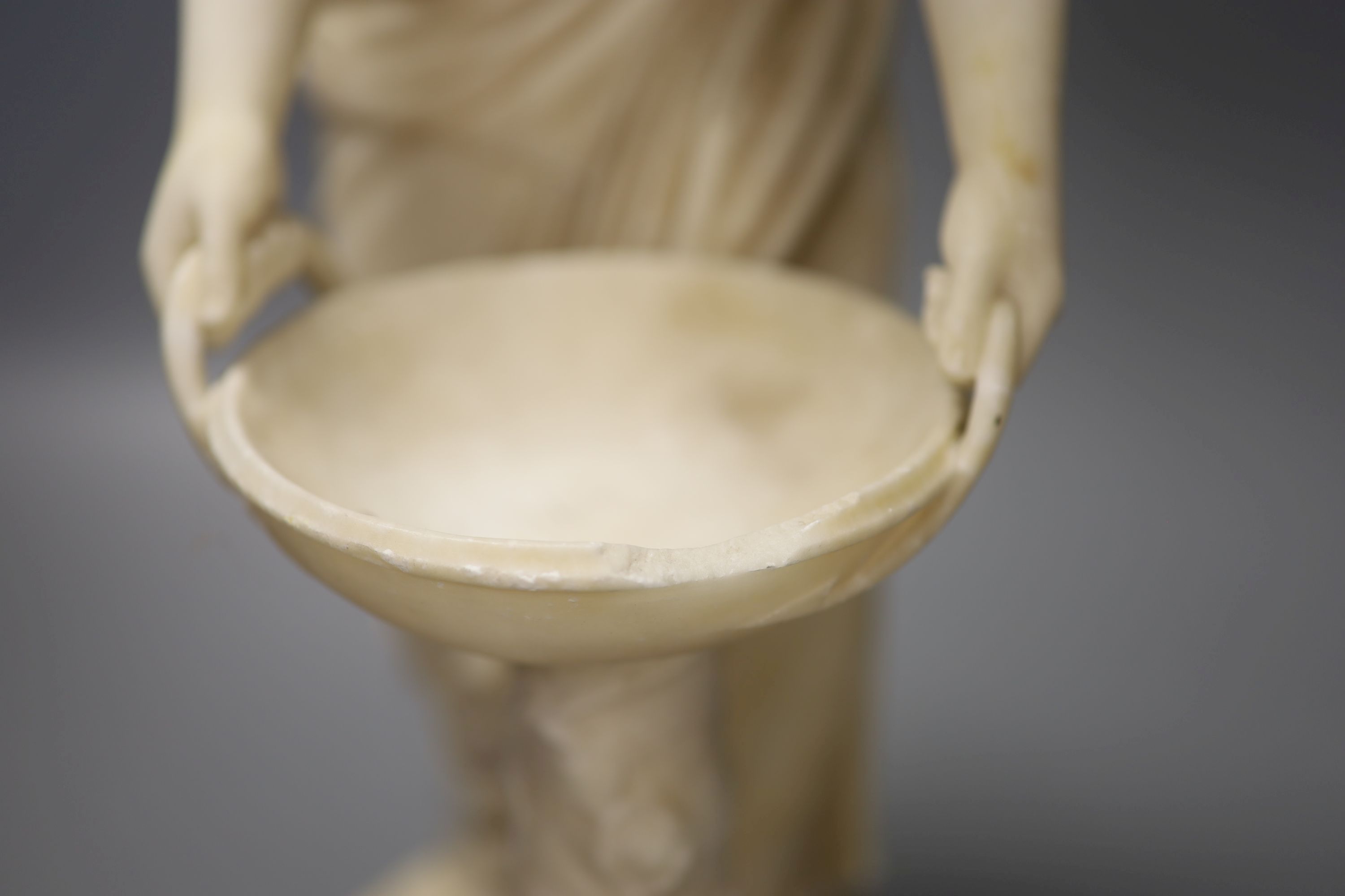 A classical alabaster figure of a water carrier, height 52.5cm